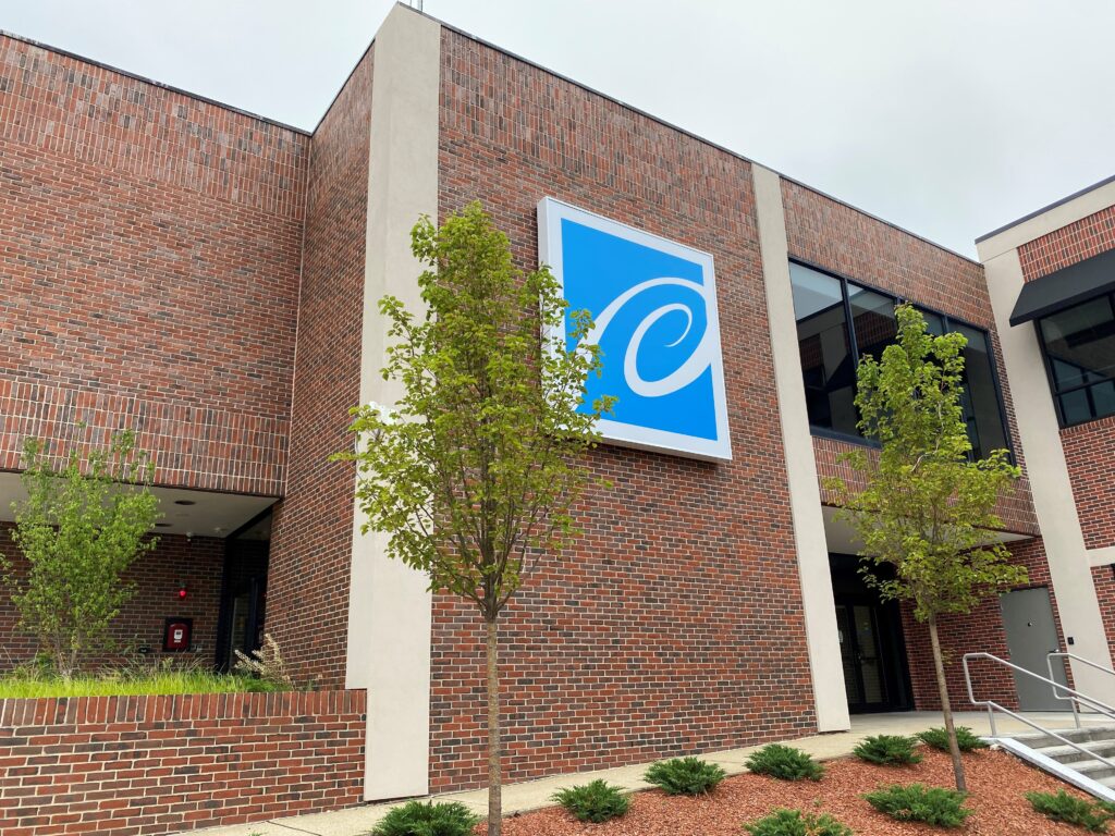 Pennichuck Corporate office - brick building with Pennichuck logo