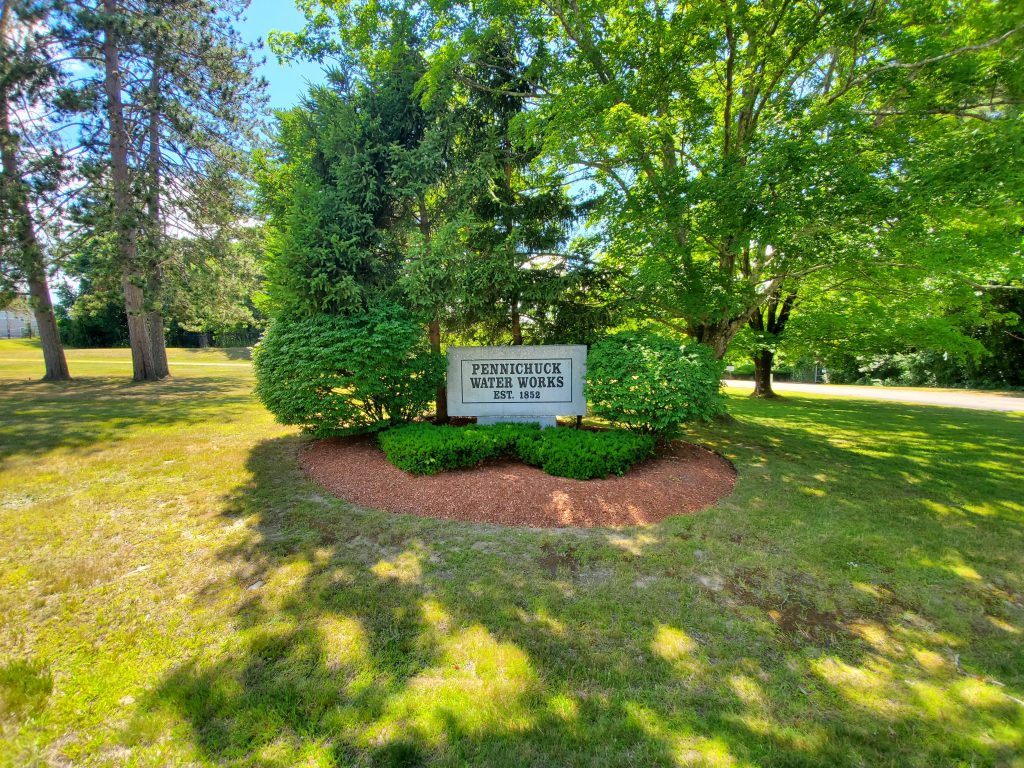 Photo of the granite Pennichuck sign, Nashua, NH.