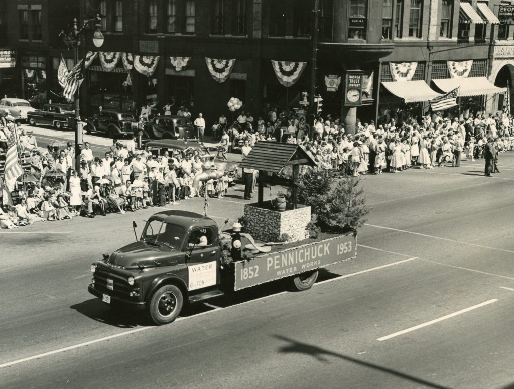Photo of Pennichuck's parade float in a parade on Main St. in Nashua circa 1953.